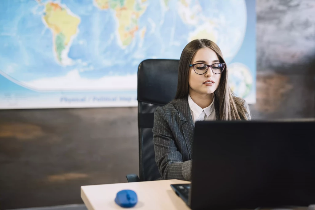 business woman using laptop LATAM global mobility